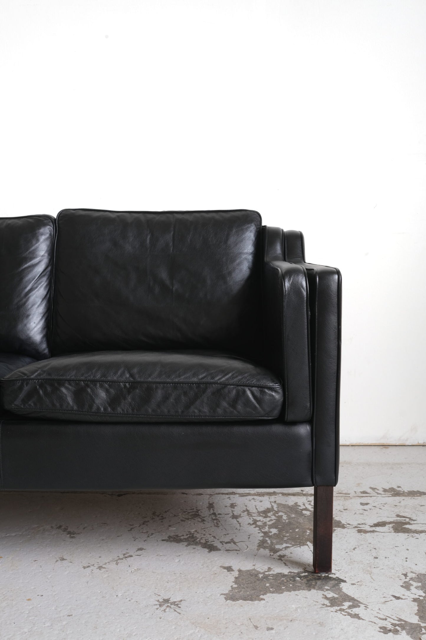 Stouby, two-seater sofa black leather