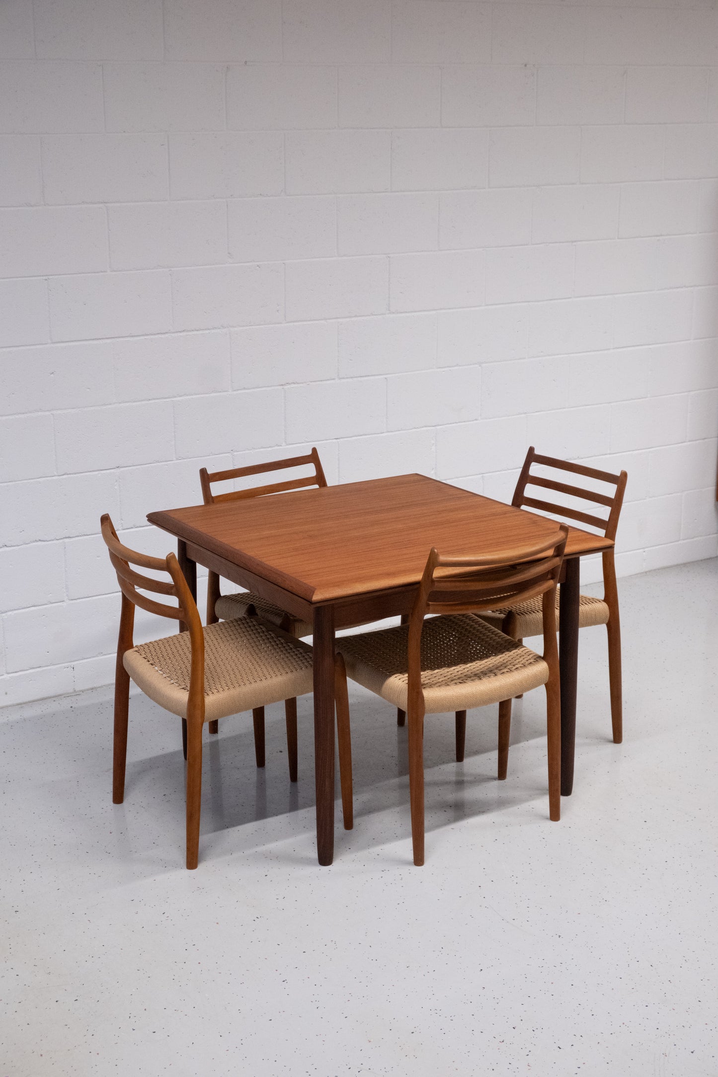 Danish teak square dining table with dutch extensions
