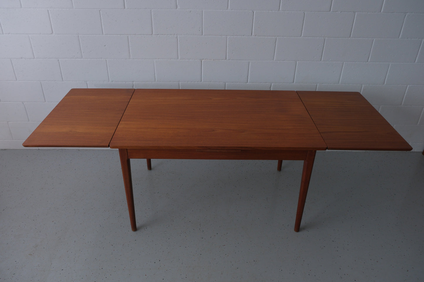 Danish teak dining table with dutch extensions