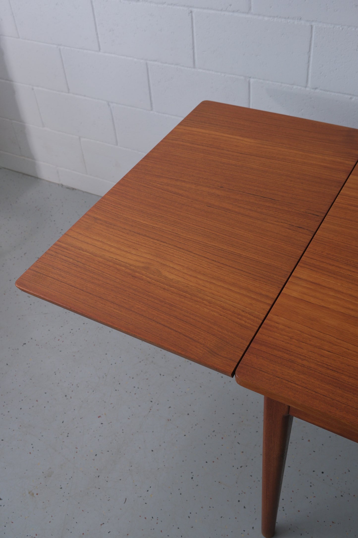 Danish teak dining table with dutch extensions