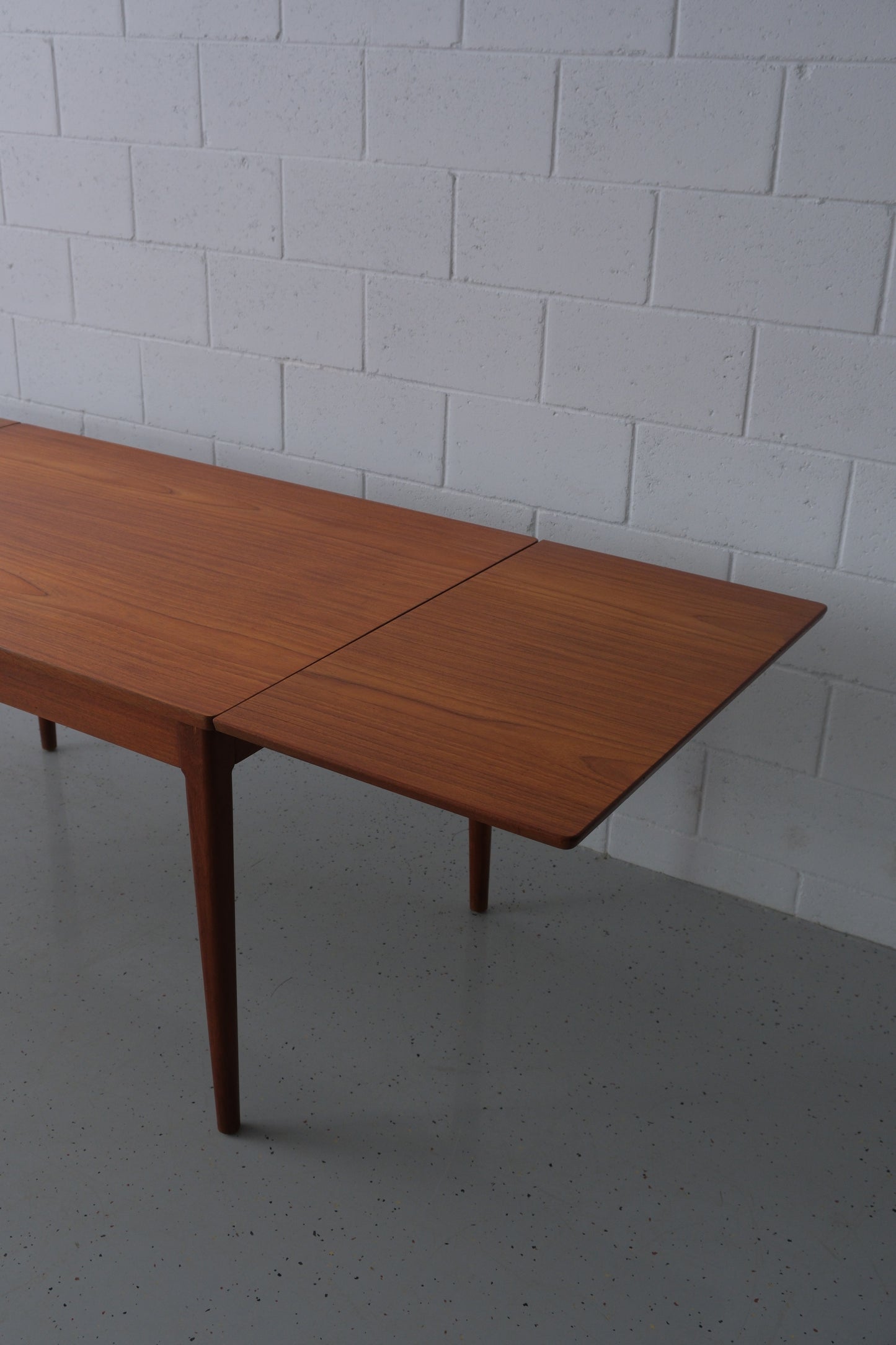 Danish teak dining table with dutch extensions