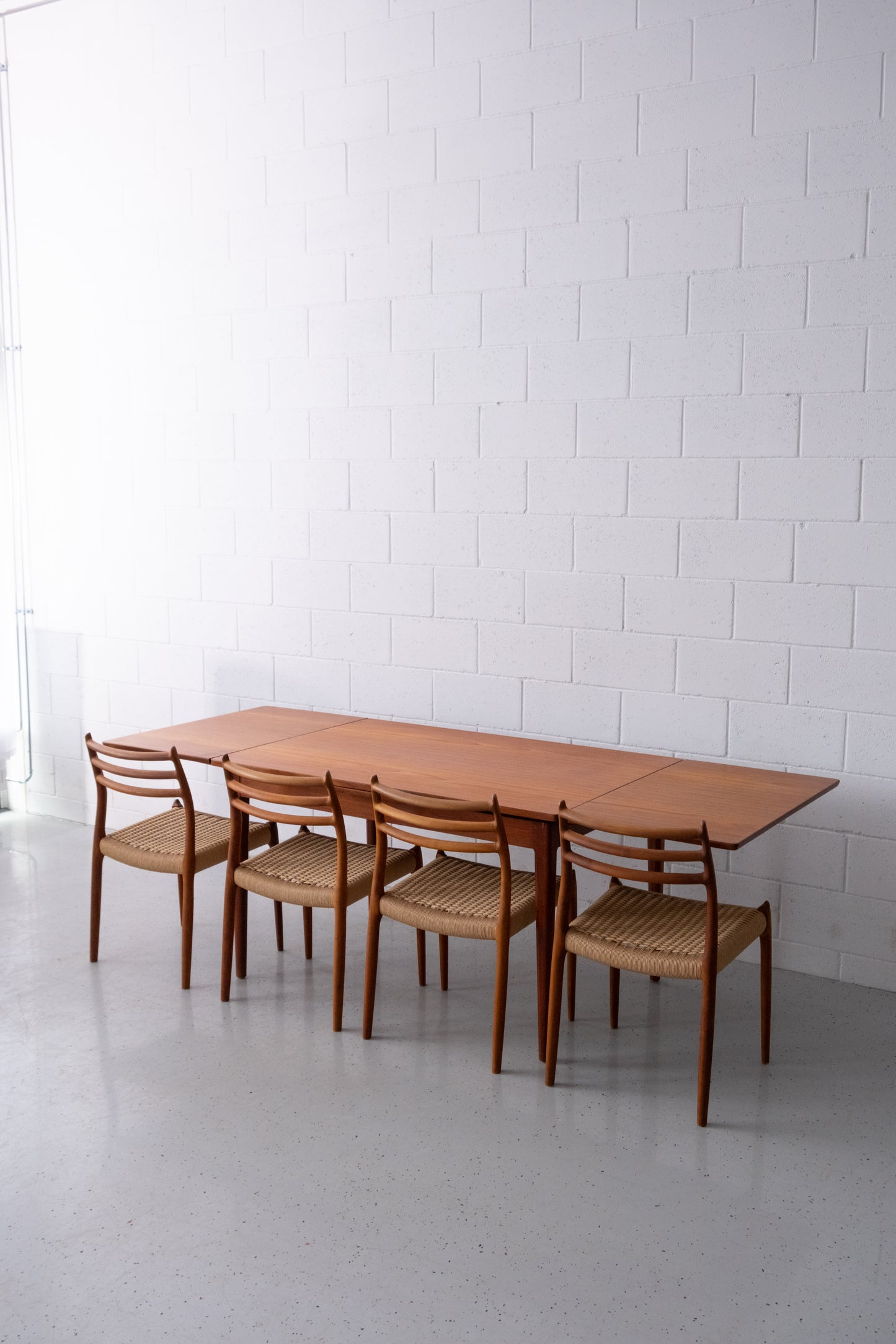 Danish teak dining table with dutch extensions