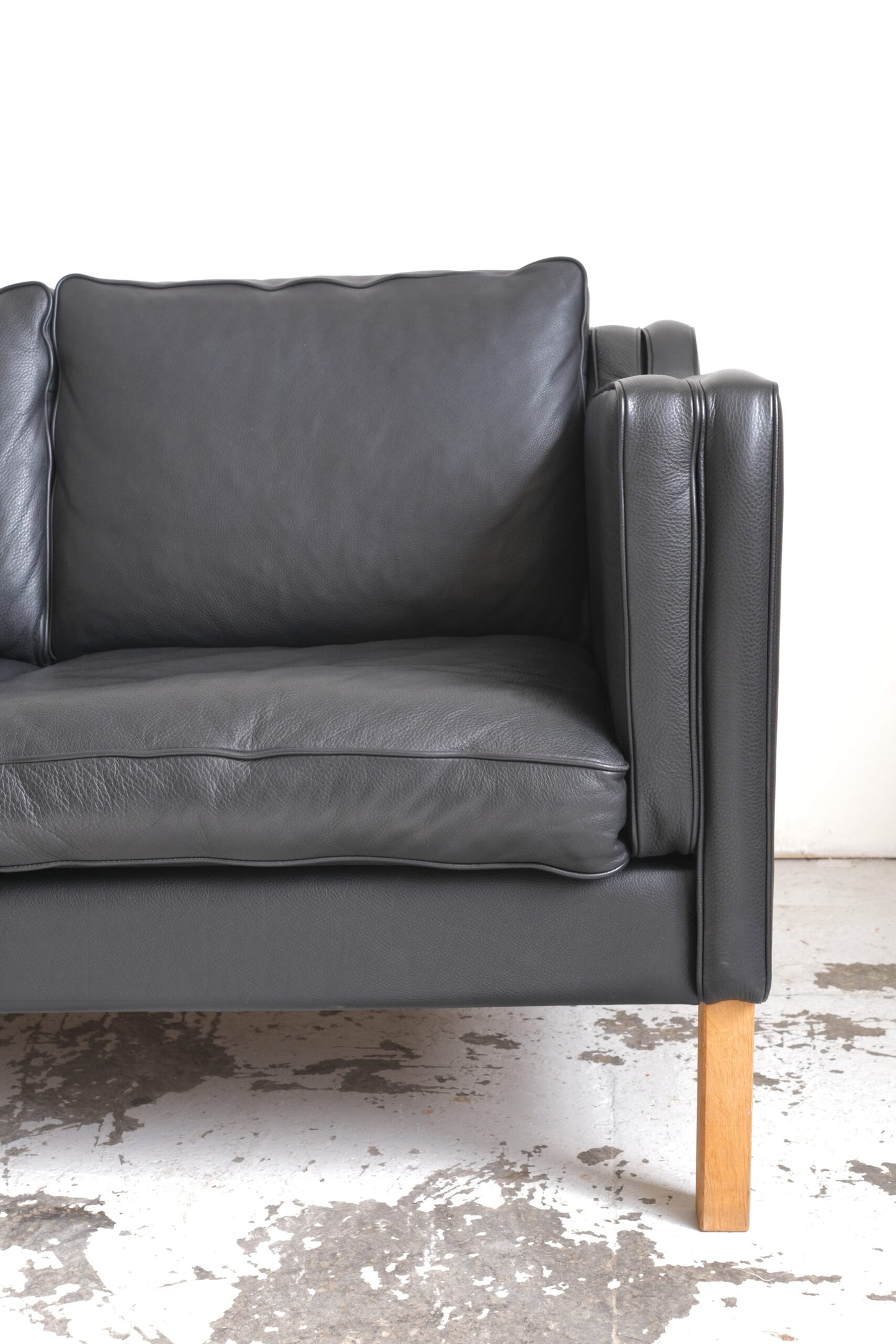 Stouby. Three-seater sofa in black leather, model 'Eva'.