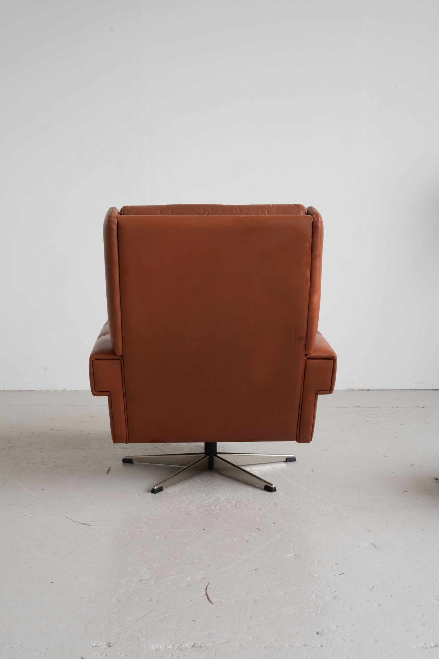 Danish cognac leather armchair with footstool (1960s)