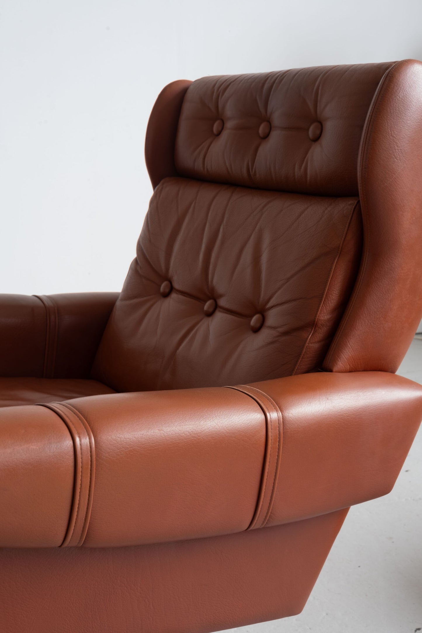 Danish cognac leather armchair with footstool (1960s)