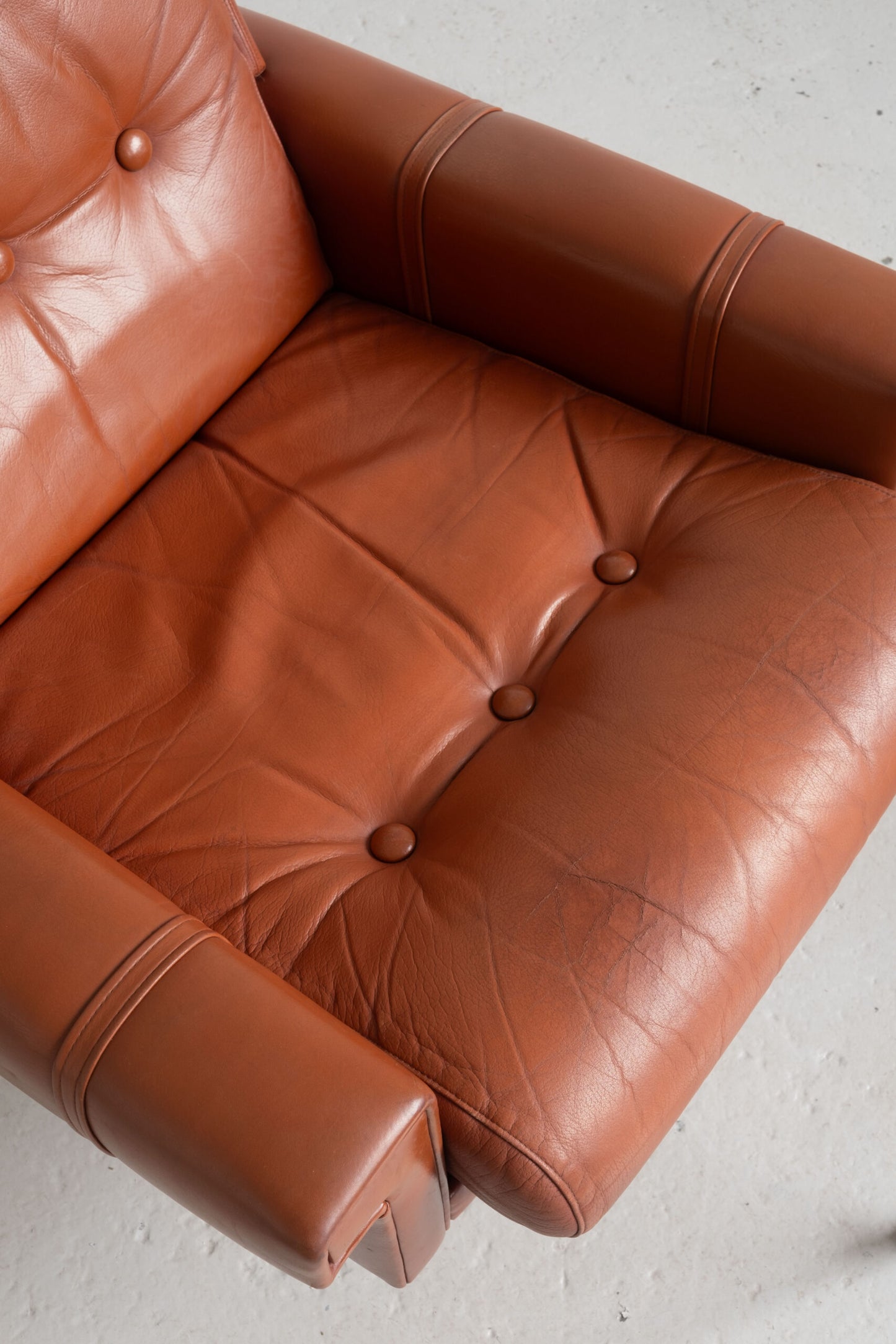 Danish cognac leather armchair with footstool (1960s)